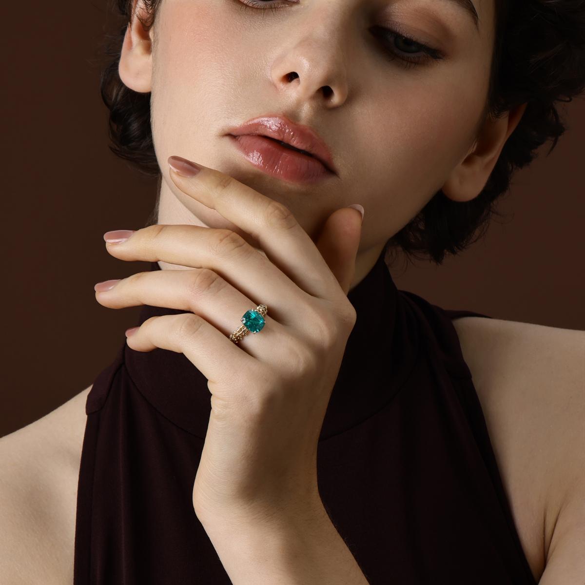 Model wearing the Jill Cushion Cut Lab Grown Paraiba Ring in 14k Yellow Gold