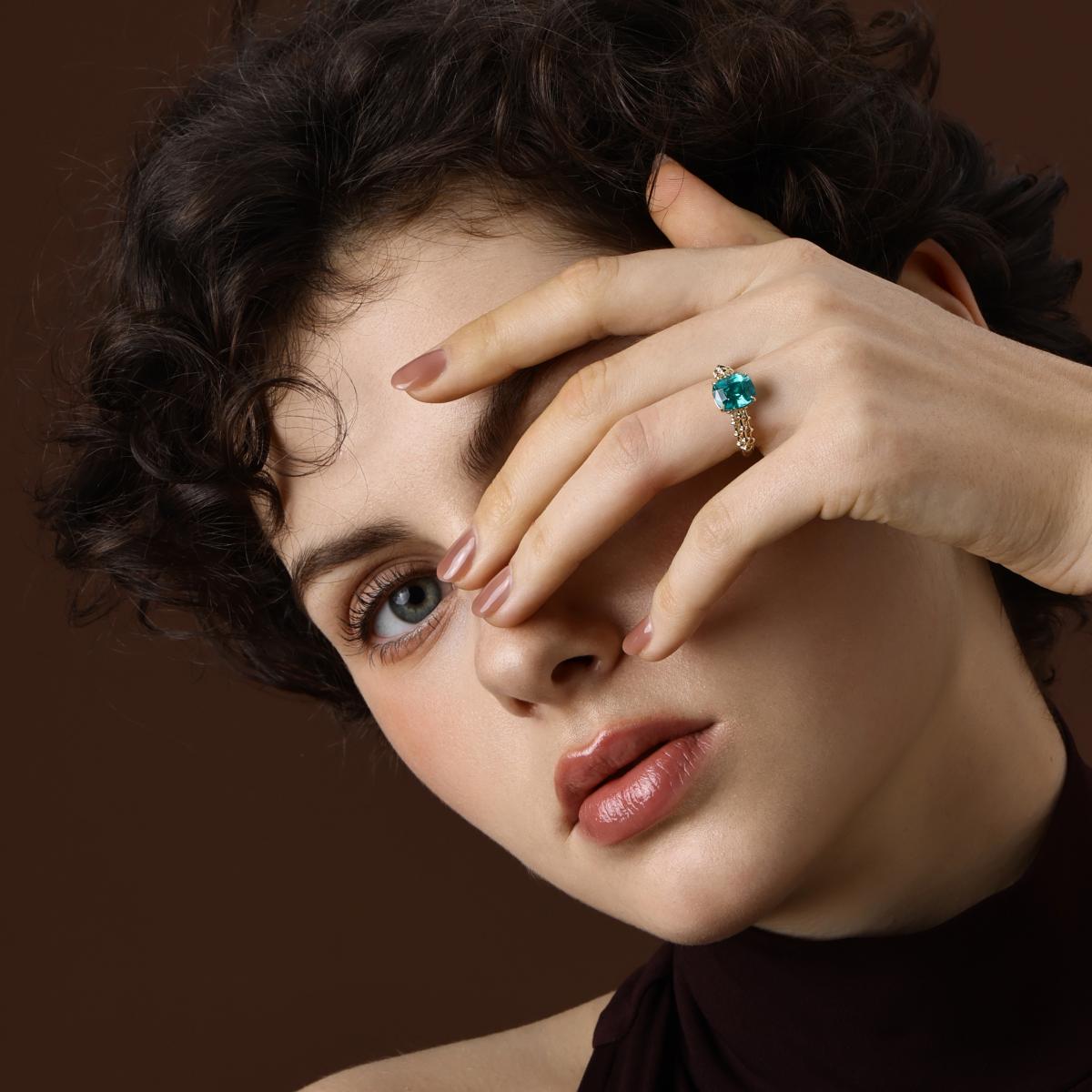 The Jill Cushion Cut Lab Grown Mint Green Sapphire Ring in 14k Yellow Gold worn on hand