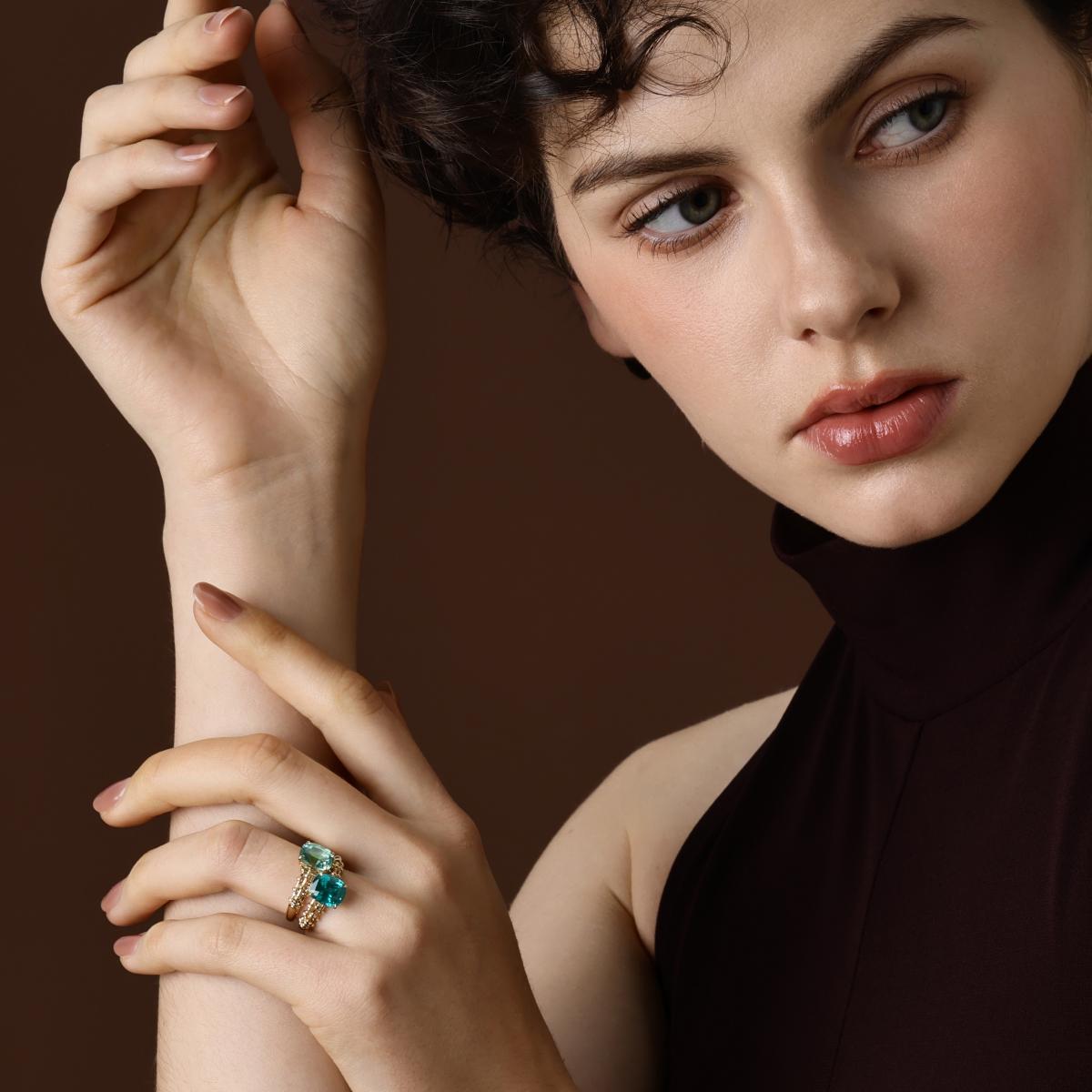 Model wearing the Jill Cushion Cut Lab Grown Mint Green Sapphire Ring styled with a Cushion Cut Lab Grown Paraiba Ring