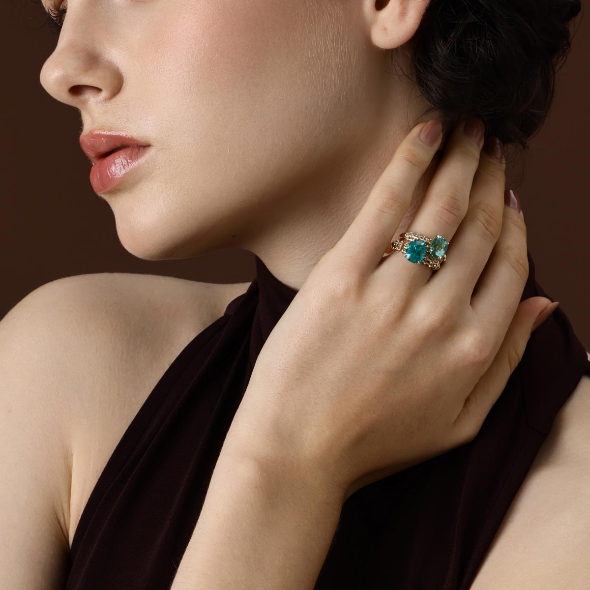 Model wearing the Jill Cushion Cut Lab Grown Paraiba Ring styled with a Cushion Cut Mint Green Sapphire Ring