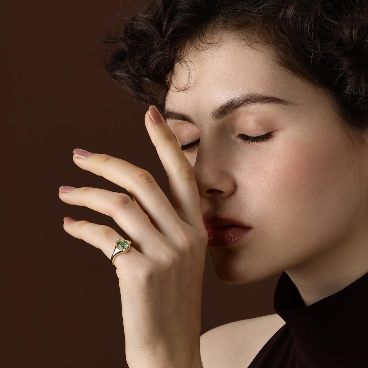 Model Wearing the Evie Pear Cut Lime Green Tourmaline Ring as a pinky ring