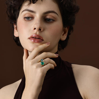 Model Wearing an Oval Cut Lab Grown Emerald Ring styled with other ring