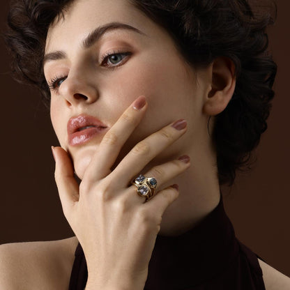 Model wearing cushion cut gemstone rings styled together