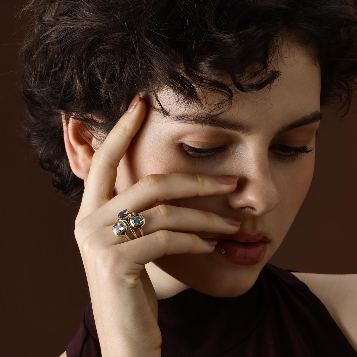 Model Wearing the Ellie Cushion cut light purple spinel ring styled with other rings