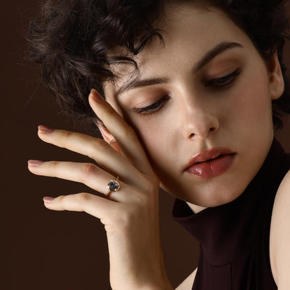 Cushion Cut Green Spinel Ring in yellow gold worn on hand