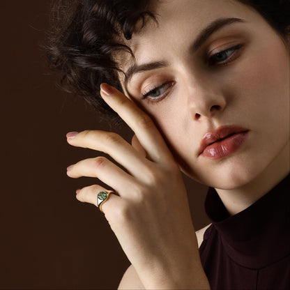 Model wearing Oval Cut Green Tourmaline Ring in yellow gold
