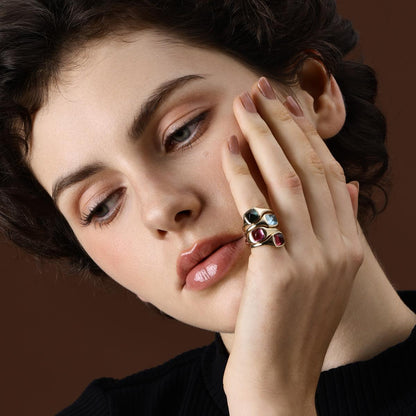 Model wearing Sugarloaf Cabochon gemstone rings in different colors