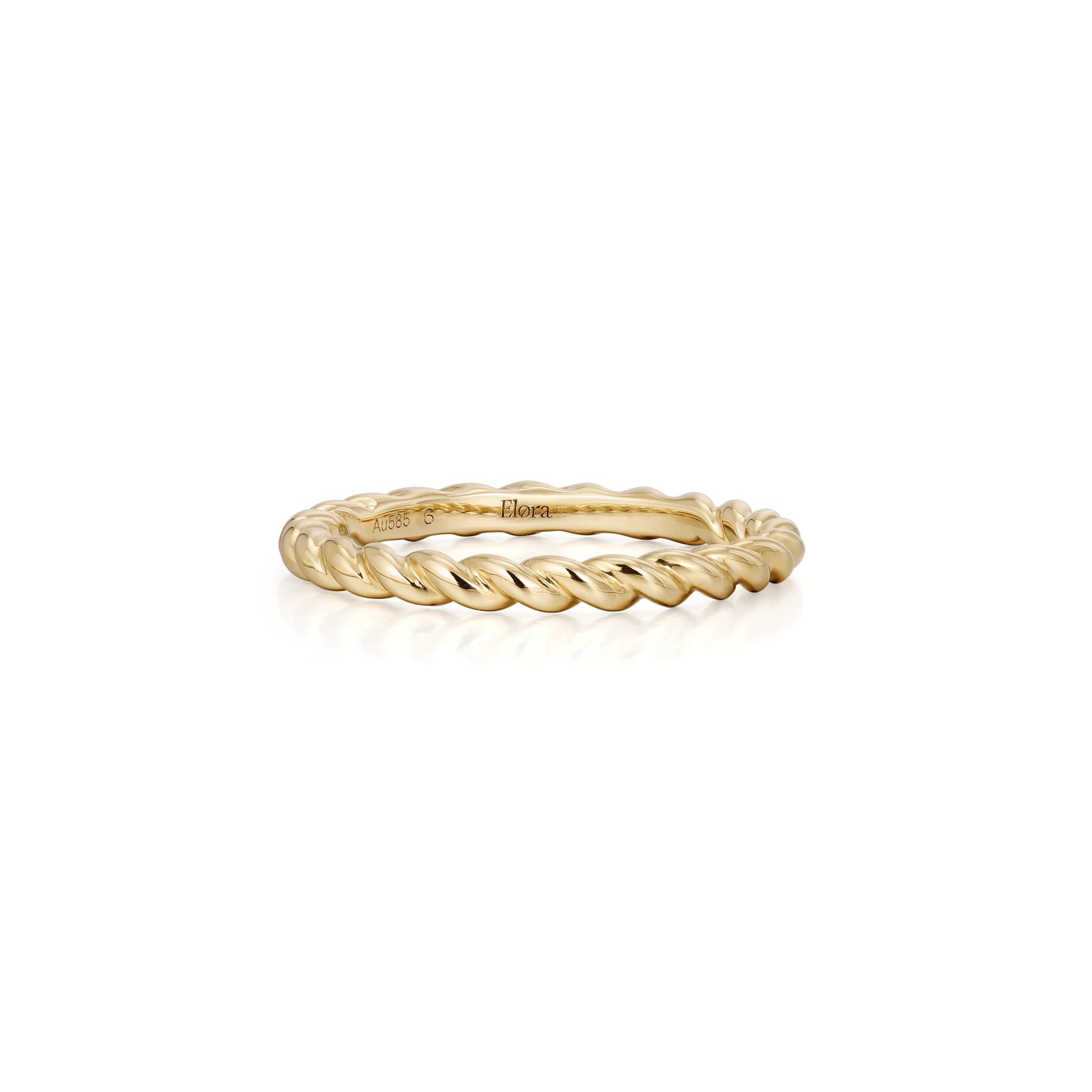 Gold ring with twisted design on a white background