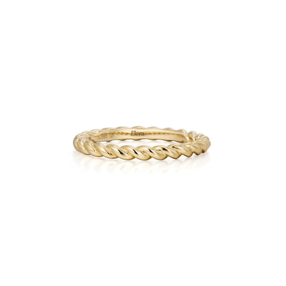 Gold ring with twisted design on a white background