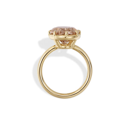 Bellini-Champagne Oval Lab Grown Diamond Engagement Ring showcases a stunning fancy intense brownish pink diamond in a 14K yellow gold setting.