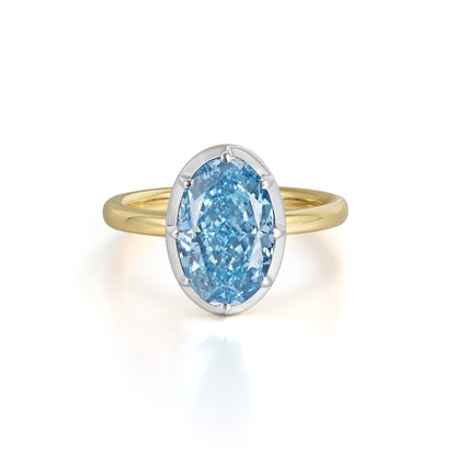 Skye-Blue Oval Lab Grown Diamond Engagement Ring featuring a fancy vivid blue diamond in 14K yellow and white gold.