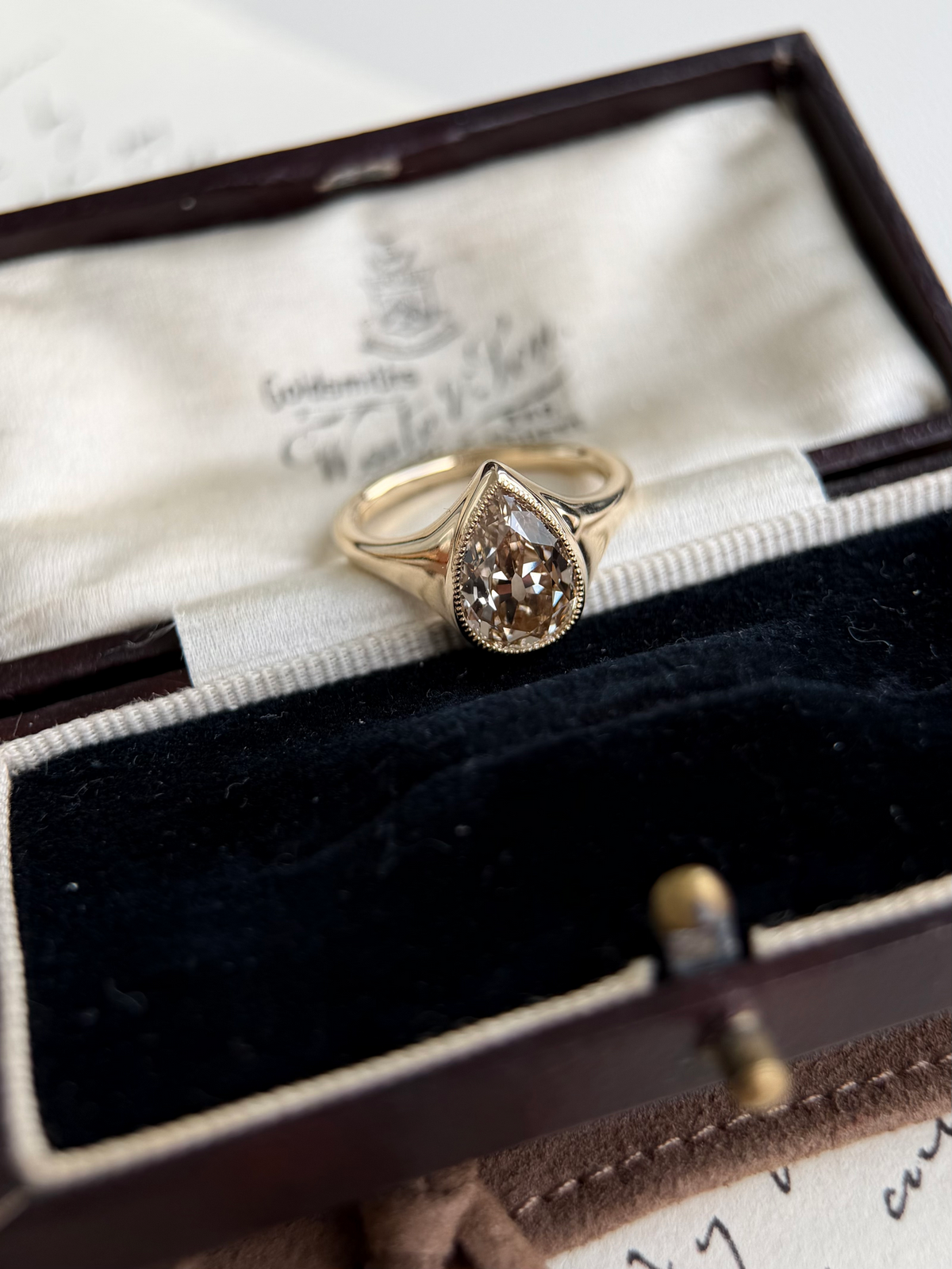 Eddy-Champagne Old Mine Pear Lab Grown Diamond Ring in vintage box with antique styling.