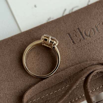 Sintra-Champagne Asscher Cut Lab Grown Diamond Ring on a brown suede surface, showcasing its elegant design.