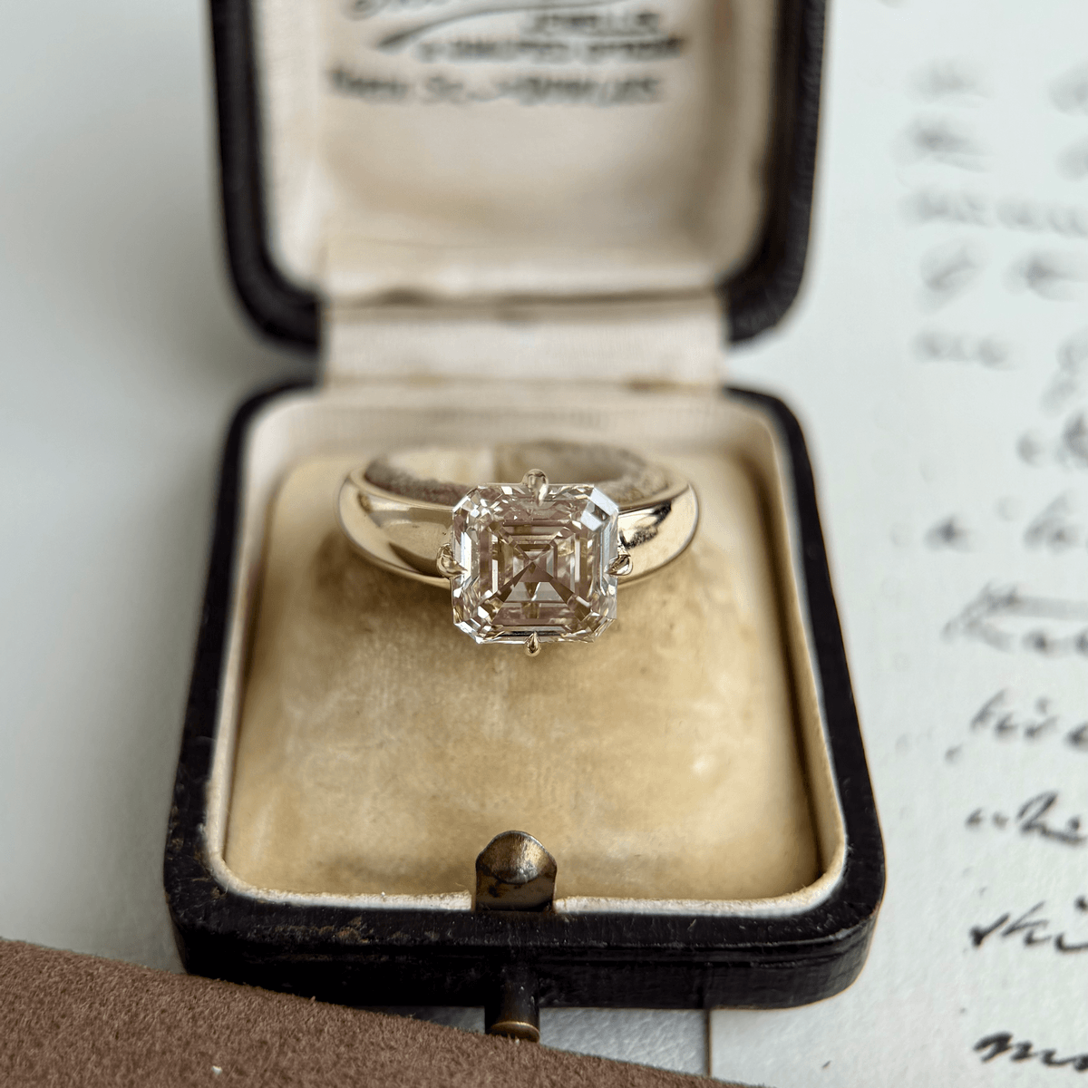 Sintra-Champagne Asscher Cut Lab Grown Diamond Ring in a classic four prong setting, showcased in elegant ring box.