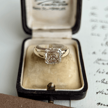 Sintra-Champagne Asscher Cut Lab Grown Diamond Ring in a classic four prong setting, showcased in elegant ring box.