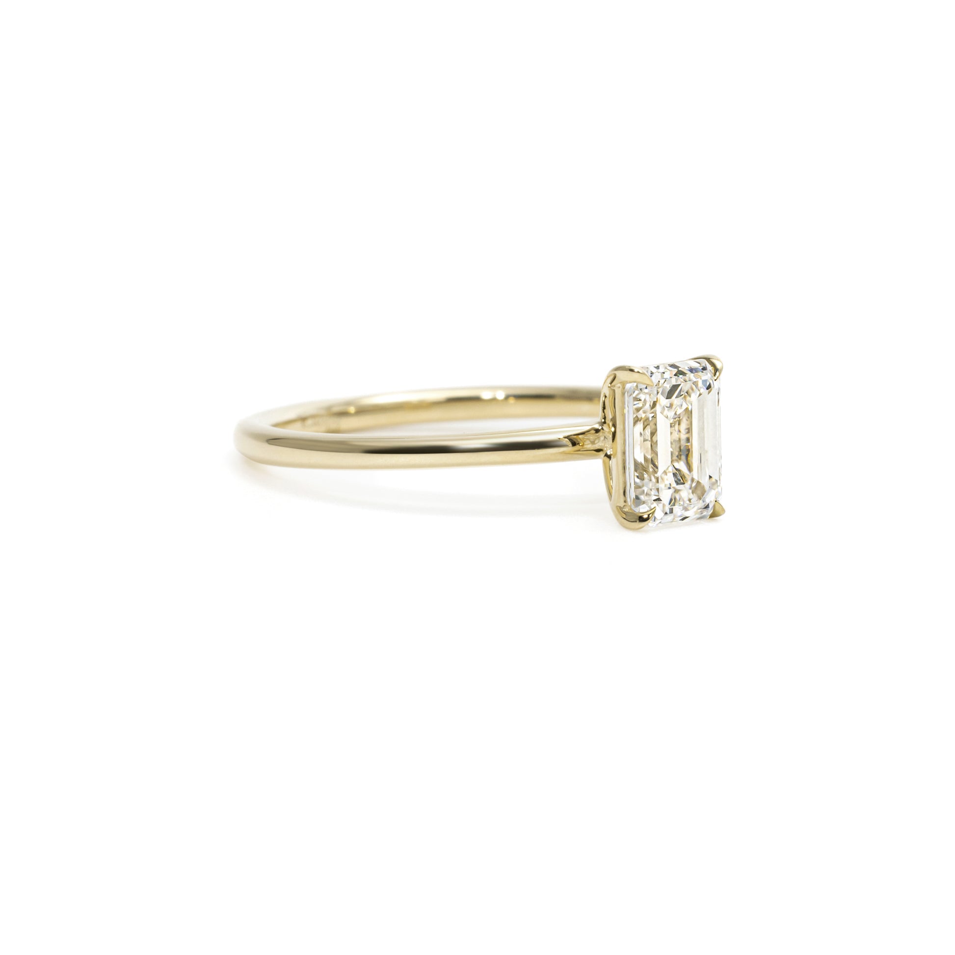 Angled view Heather Emerald Cut Diamond Engagement Ring in four-prong setting