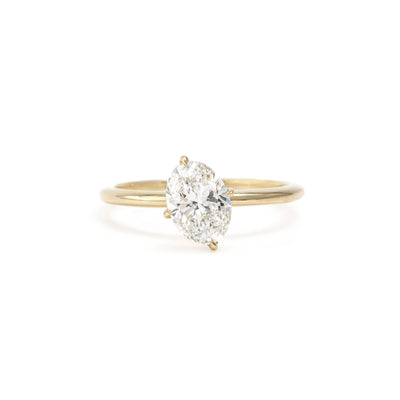 Aria ring front view with tilted oval cut lab-grown diamond in 14K yellow gold