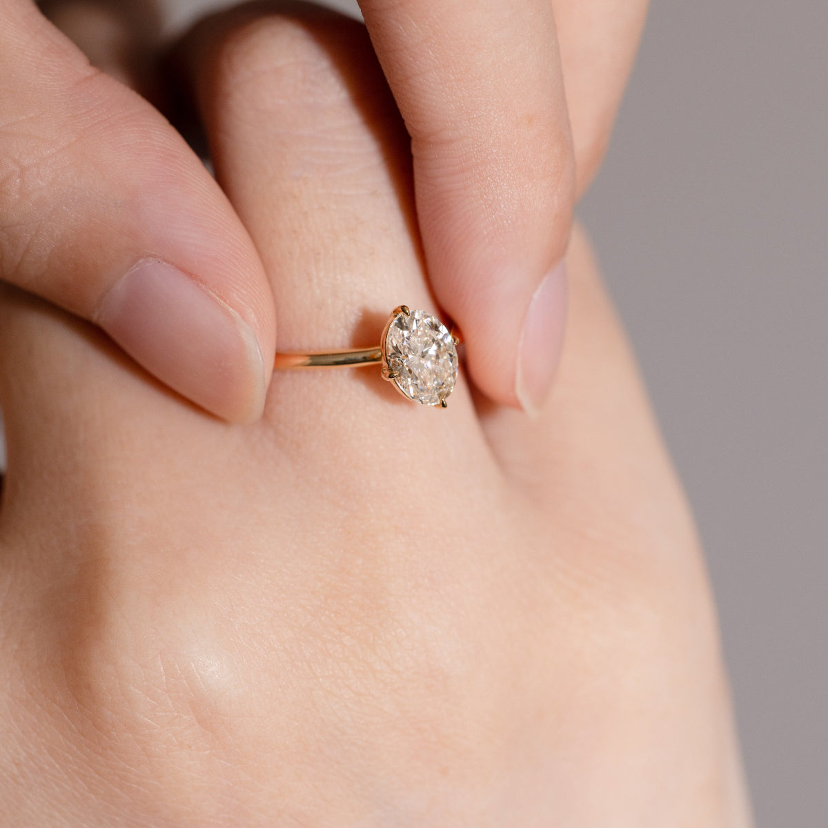 Aria ring styled alone on white surface, capturing elegance and clarity