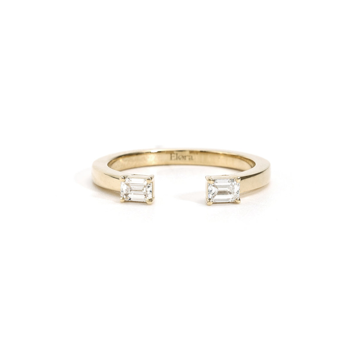 Front view Billie open band with two emerald-cut lab-grown diamonds in yellow gold