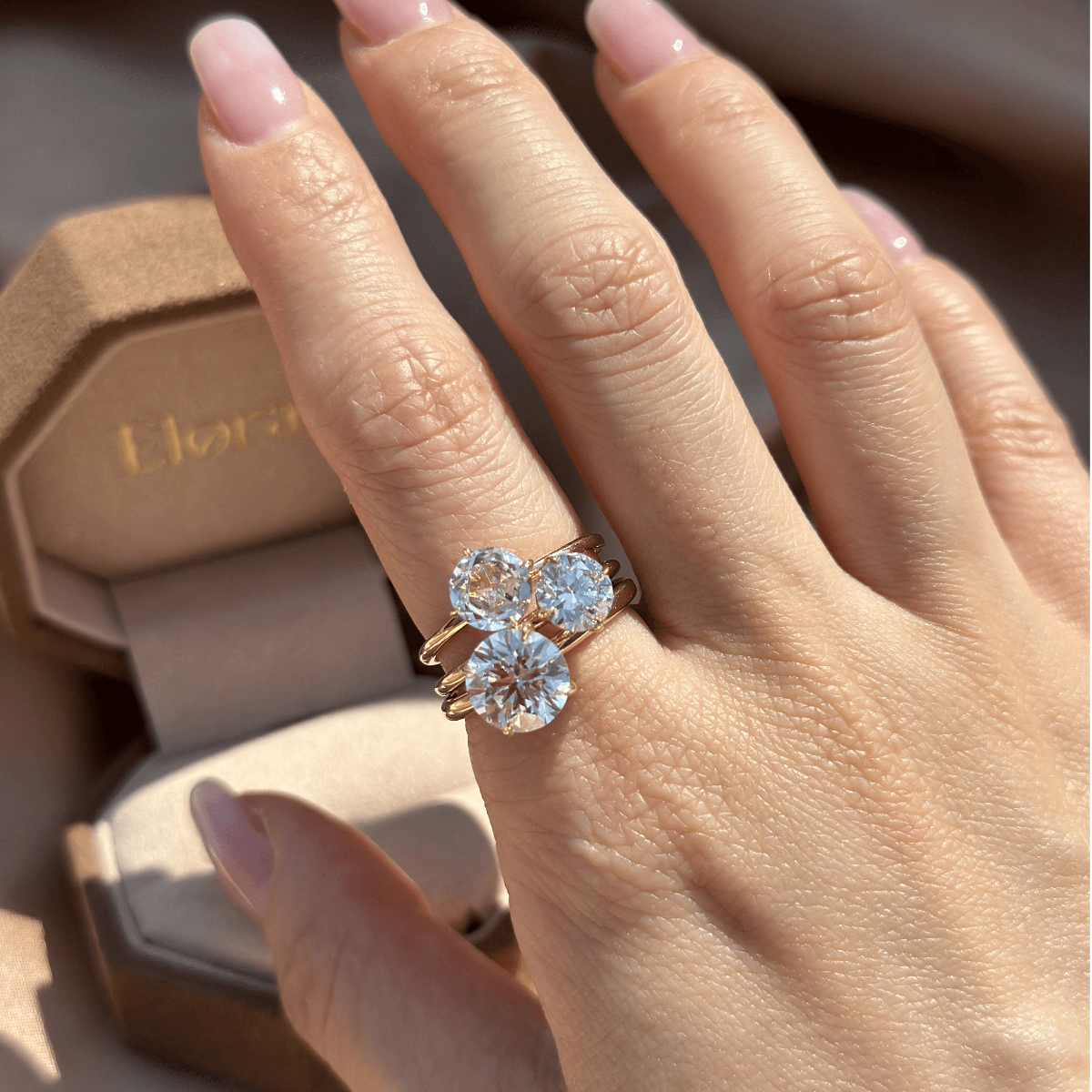 Bold stacked ring look with Layla Round diamond ring paired with 2 round cut diamond rings