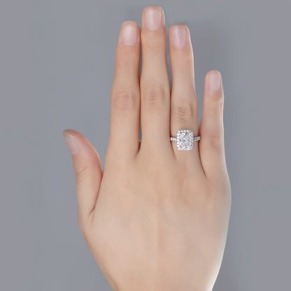 Briella Radiant Cut Pavé Lab Grown Diamond Halo Ring in platinum on ring finger
