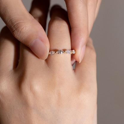 Close-up detail of Maeve pavé diamond eternity band on model’s finger
