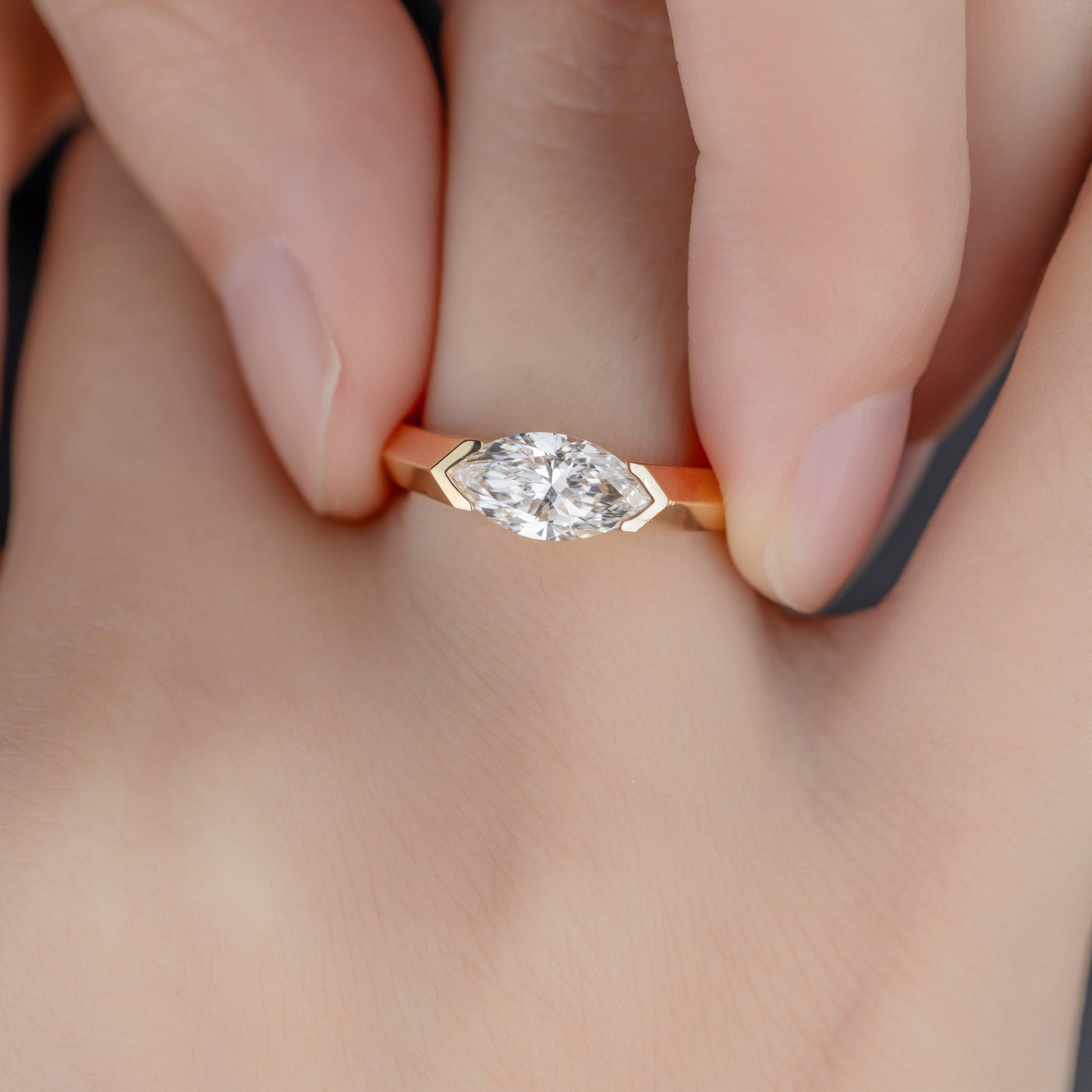 Close-up detail of marquise diamond cut and East-West setting