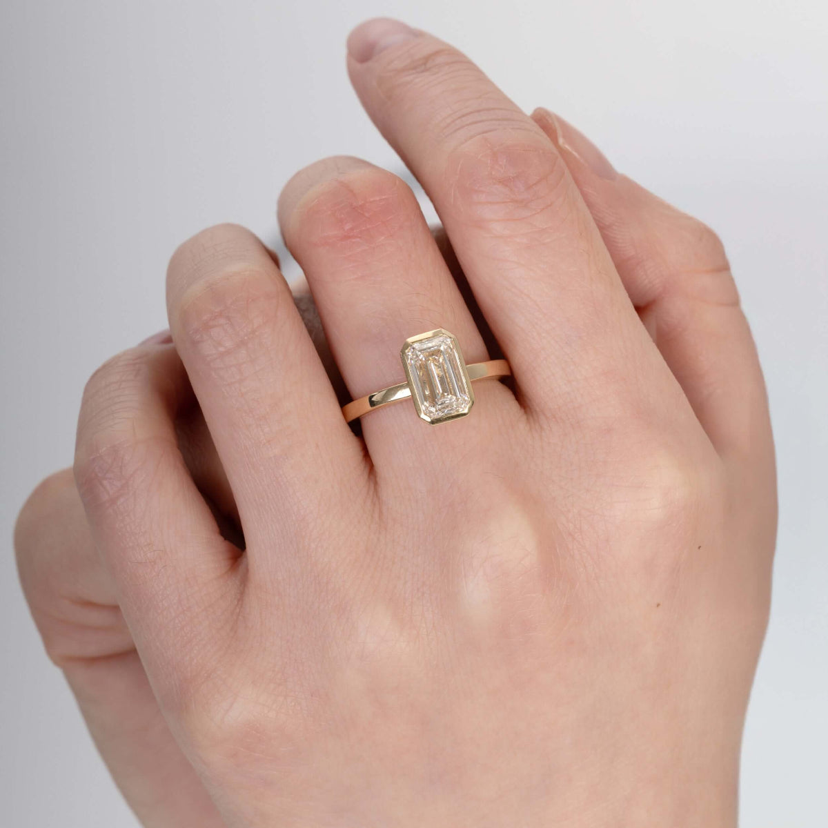 Close-up of emerald-cut lab-grown diamond reflecting light