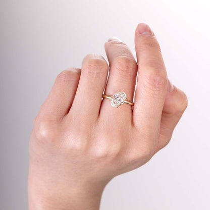Close-up of the center oval-shaped lab-grown diamond sparkling in light