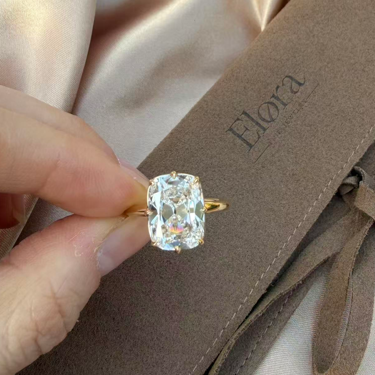Eliza-Old Mine Cut Lab Grown Diamond Engagement Ring displayed on hand with gold setting and Elora packaging.