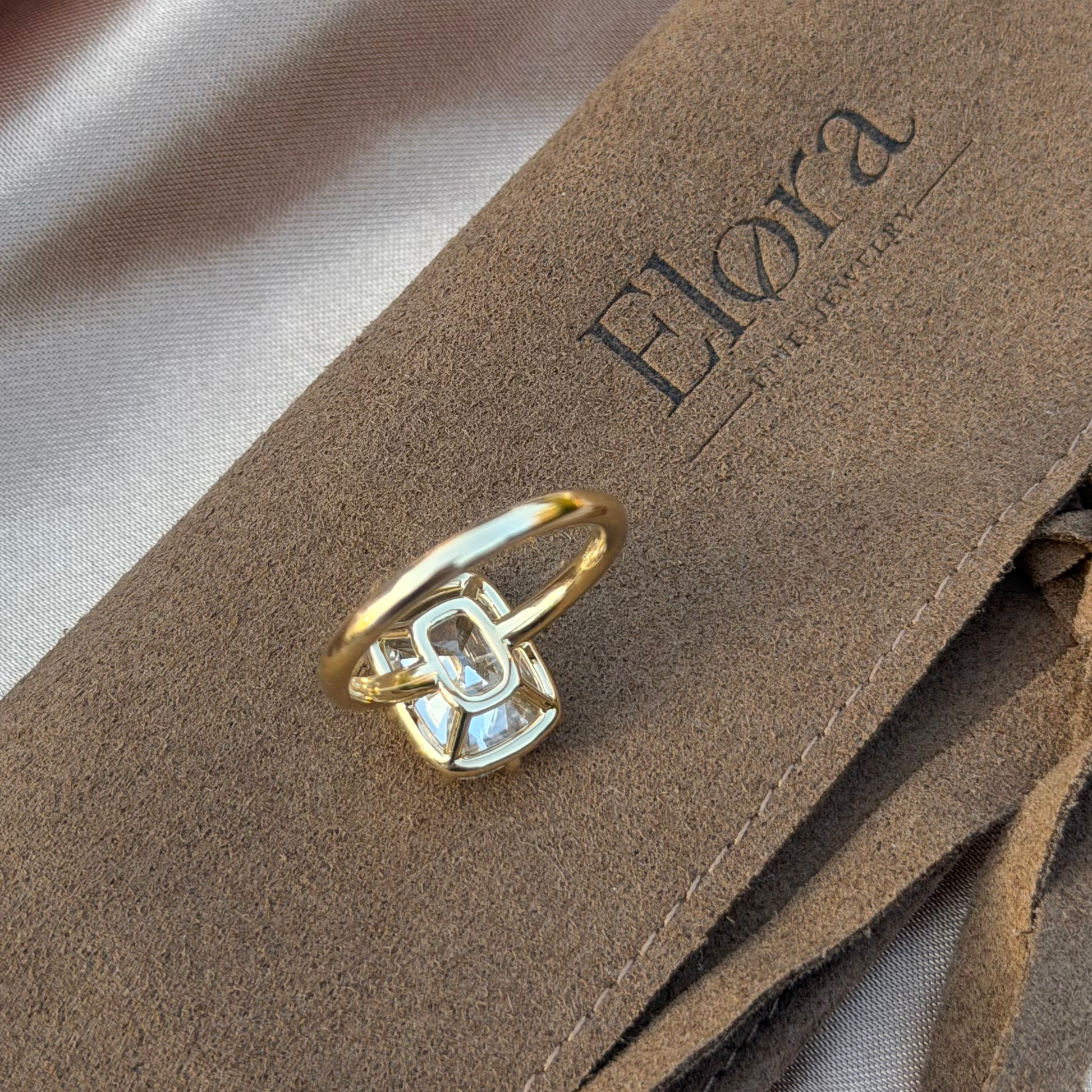 Eliza-Old Mine Cut Lab Grown Diamond Engagement Ring displayed on a soft fabric surface.