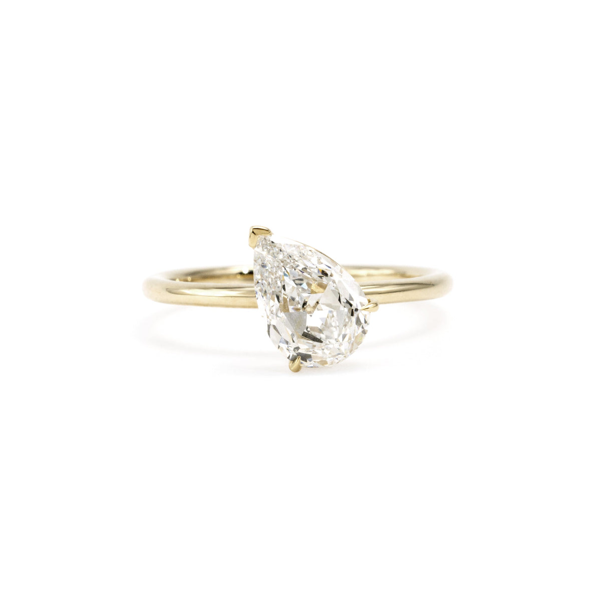 Face View of Elegant Violet Ring with tilted pear-shaped lab-grown diamond in 14K yellow gold