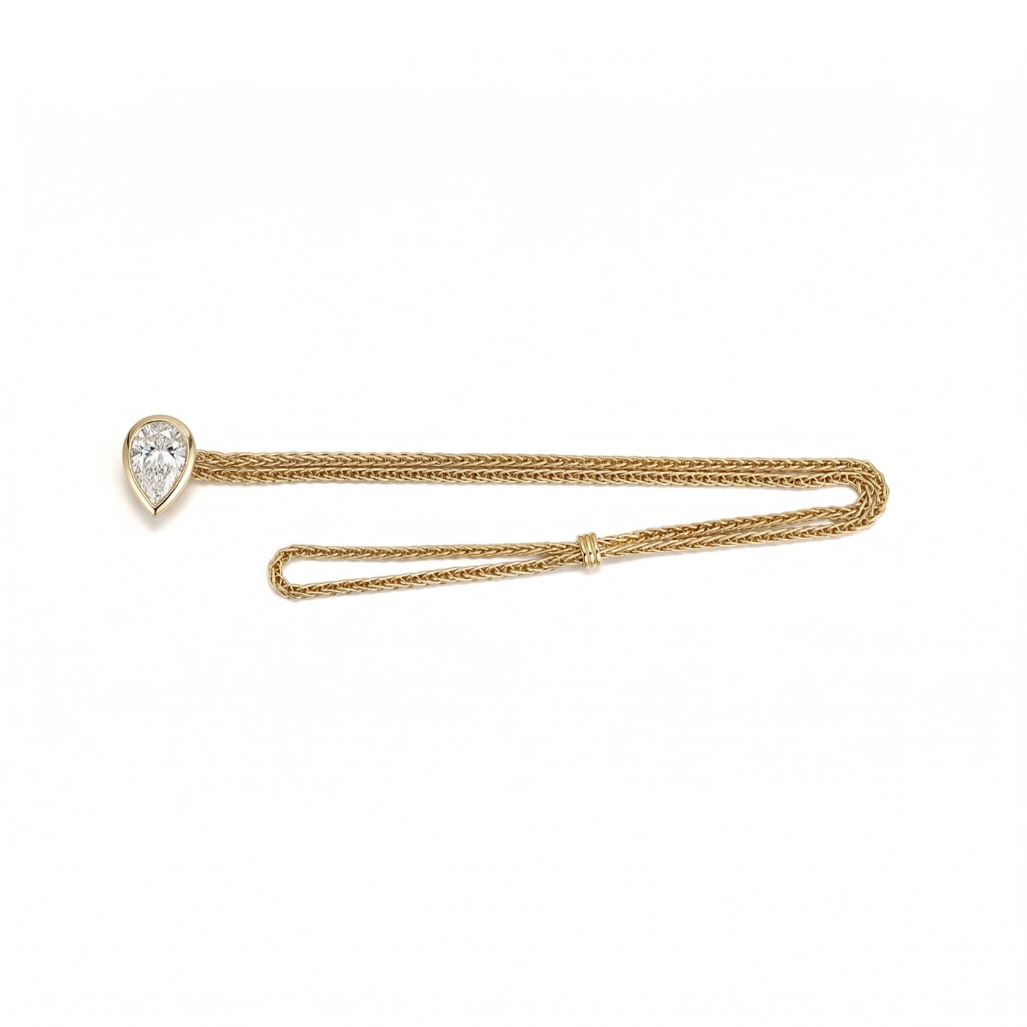 Faith-Pear Cut Lab Grown Diamond Bracelet showcasing a pear-cut diamond set on a handwoven 18K gold chain.