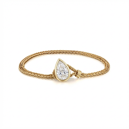 Faith-Pear Cut Lab Grown Diamond Bracelet featuring a pear-cut diamond set in a gold chain.
