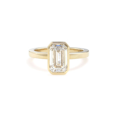 Front view of Aurora Emerald Cut Lab Grown Diamond Bezel Ring in 14K yellow gold