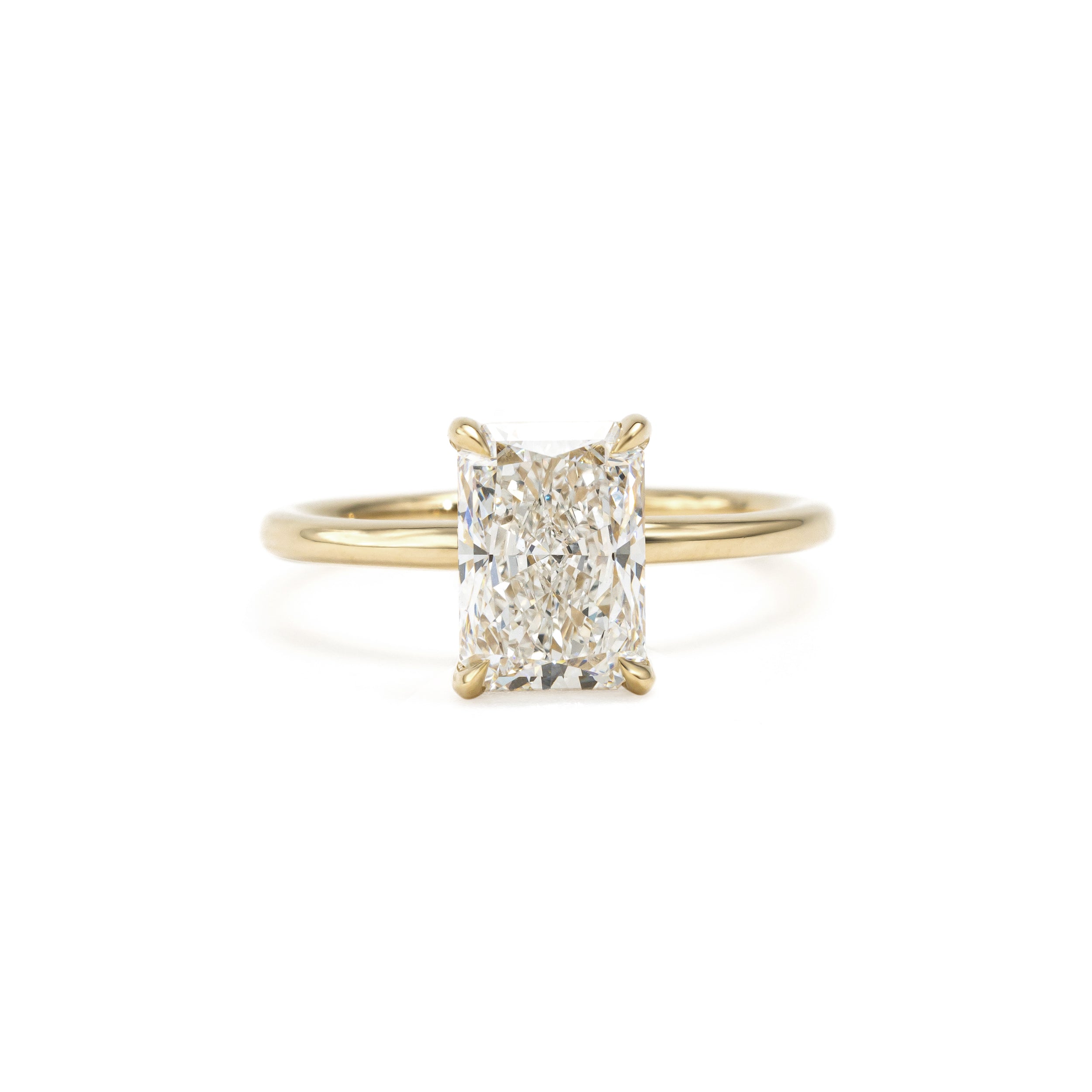 Side_hand_view_of_model_wearing_2.09ct_Radiant_Cut_Lab_Grown_Diamond_Ring_paired_with_an_eternity_band