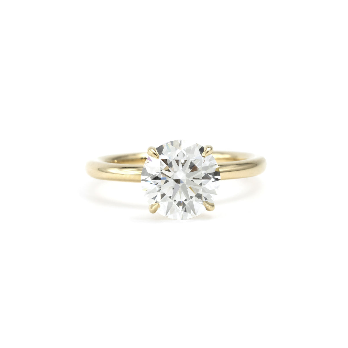 Front view round cut lab grown diamond engagement ring in 14K yellow gold
