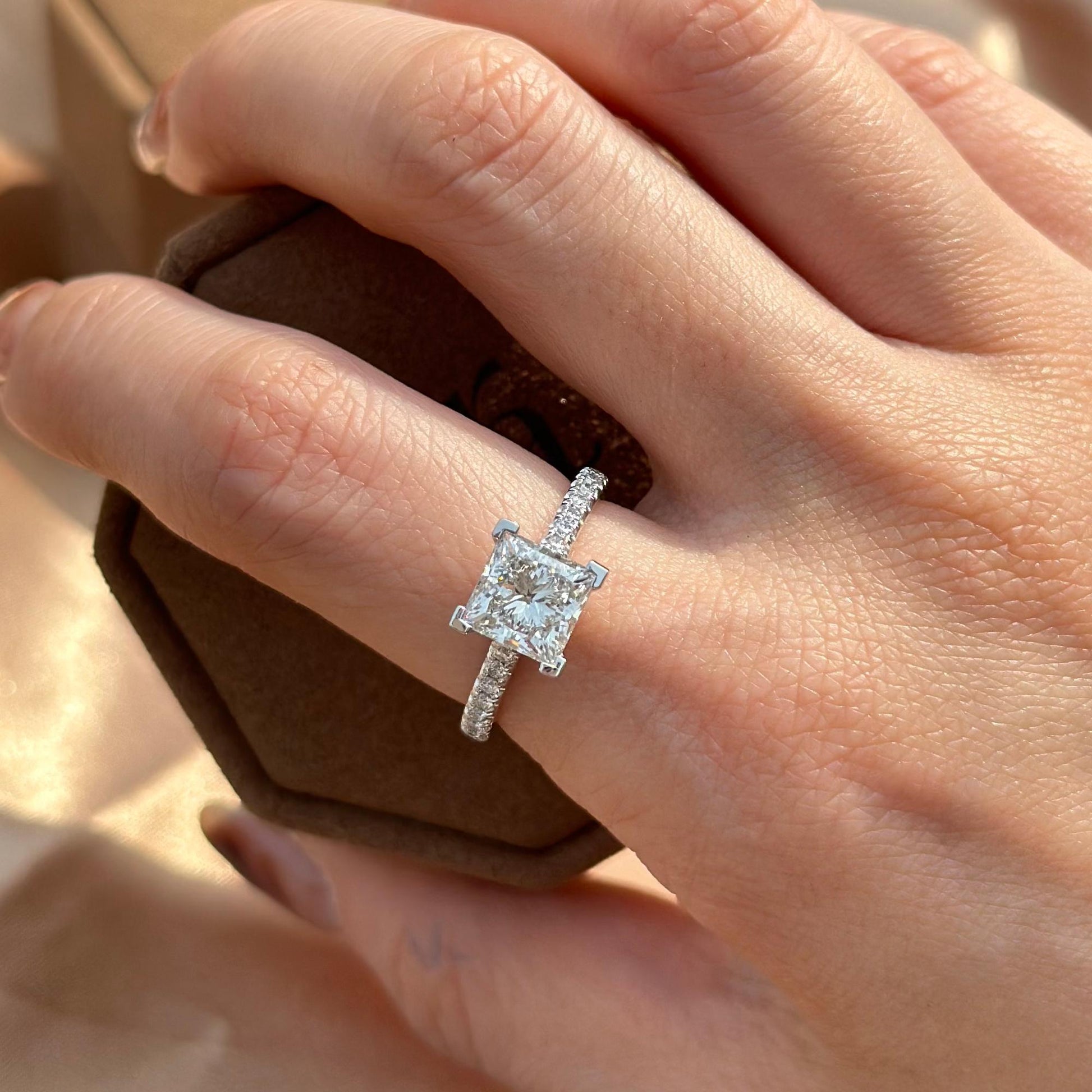 Hand-closeup Heidi Princess Cut Lab Grown Diamond Engagement Ring in a pave setting