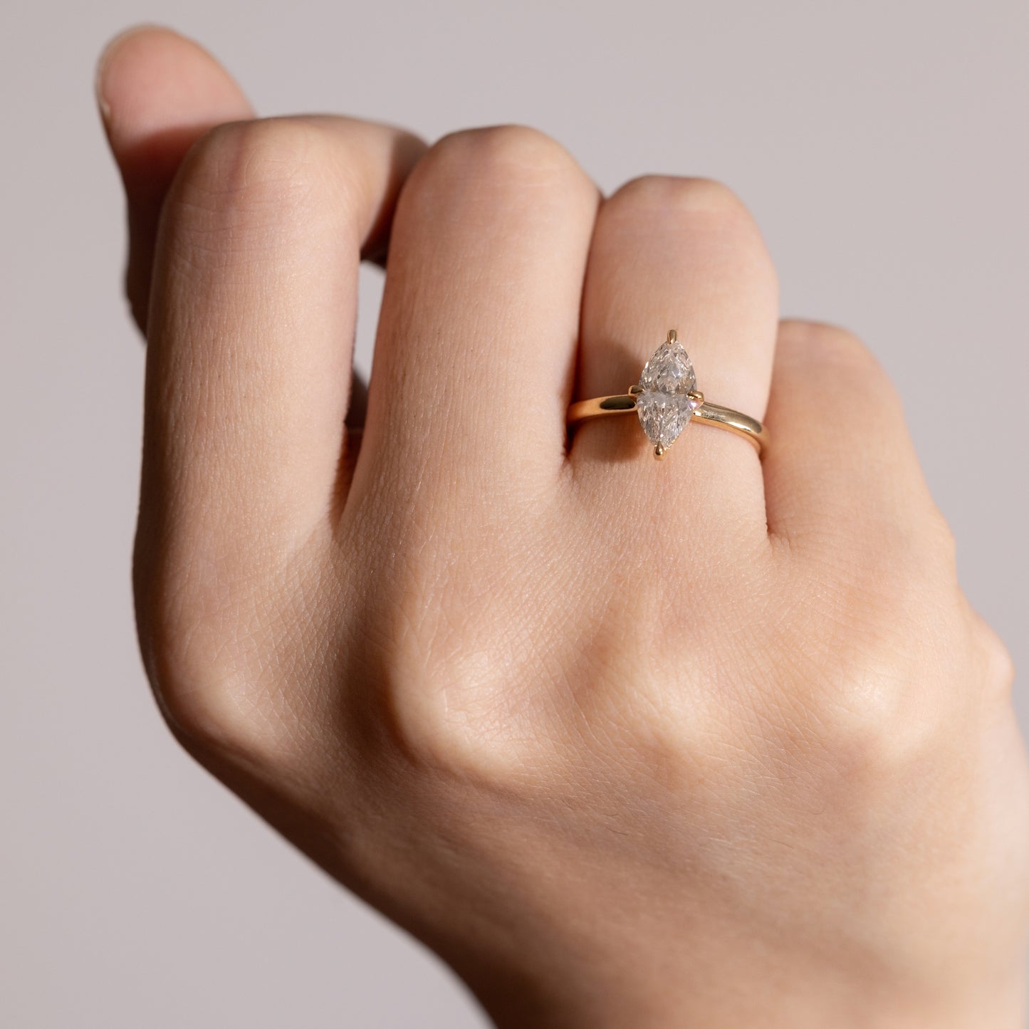 Hand shot of 1ct Anais-Marquise Cut Diamond Rings in four-prong setting