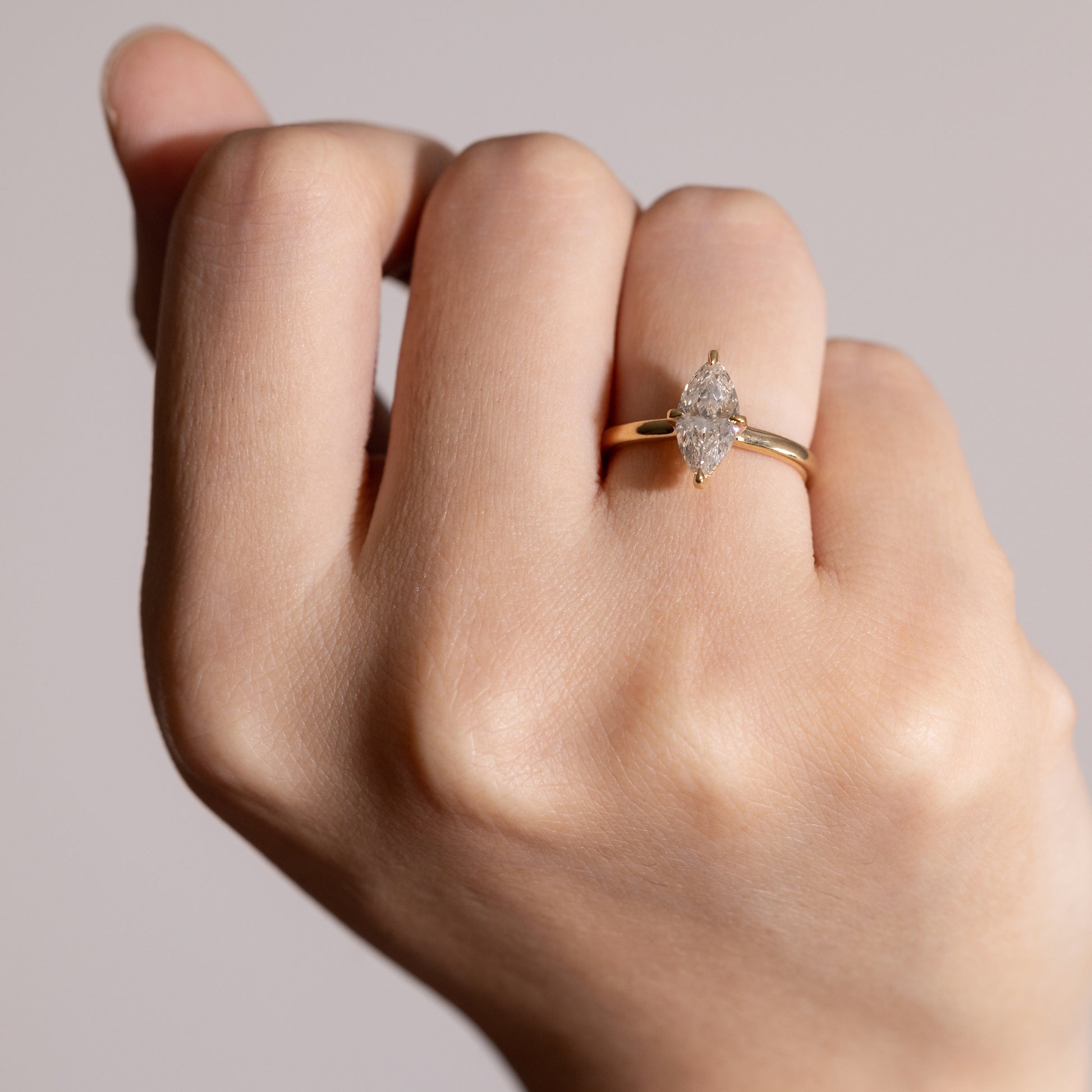 Hand shot of 1ct Anais-Marquise Cut Diamond Rings in four-prong setting