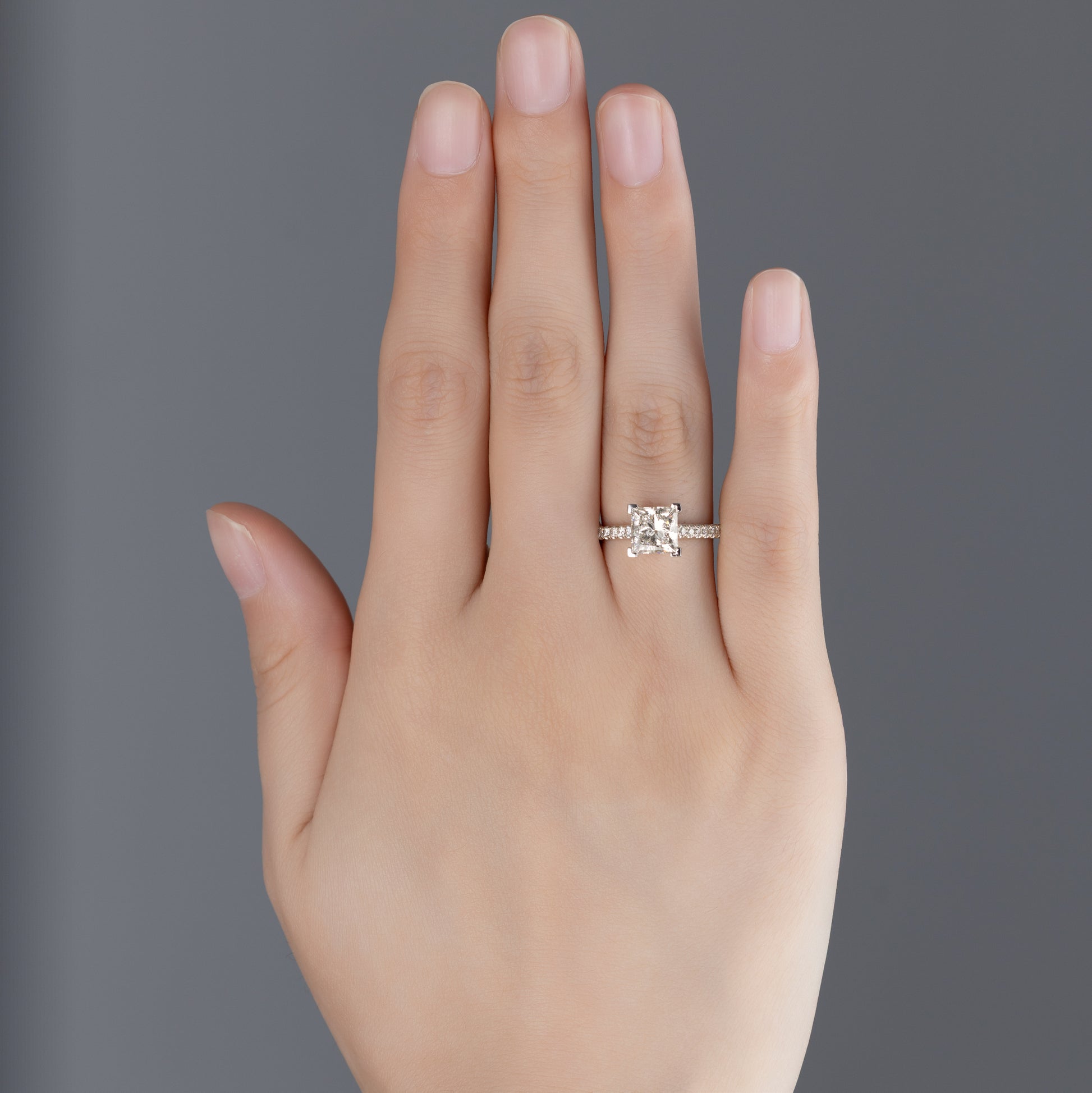 Heidi Princess Cut Pavé Lab Grown Diamond Engagement Ring in platinum on ring finger