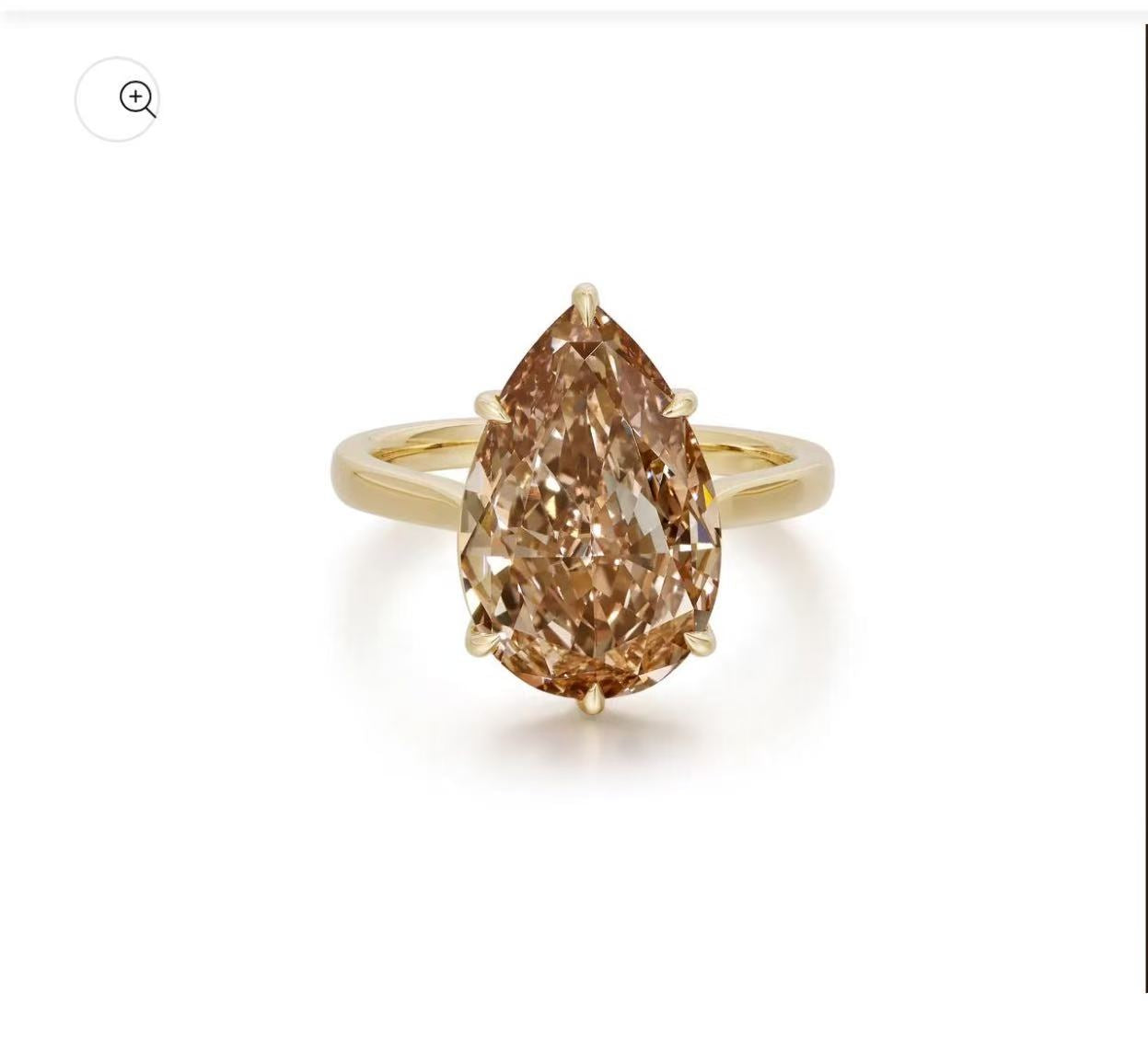 4 carat pear shape champagne color engagement ring with 3mm 14k yellow band.