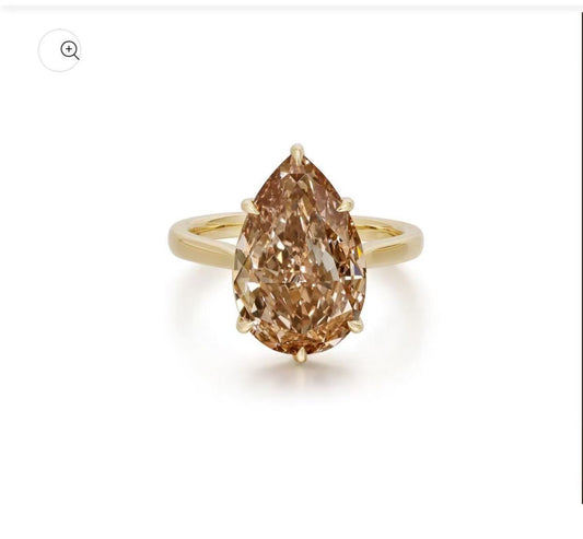 4 carat pear shape champagne color engagement ring with 3mm 14k yellow band.
