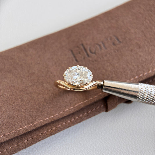 Wave-2.03ct Oval Cut Lab Grown Diamond Engagement Ring on display with a gold band.