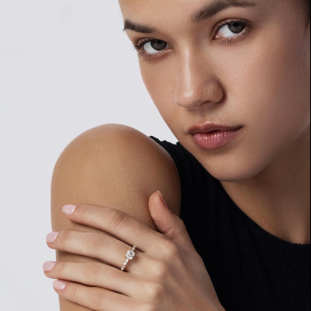 Model hand wearing Asscher cut lab-grown diamond pavé ring in minimalist style
