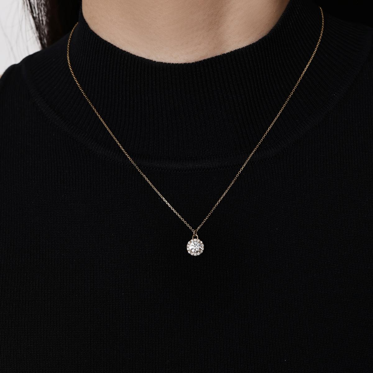 Model wearing A Halo Round Cut Diamond Pendant Necklace 7.9×9.8×5 mm Pendant dimensions