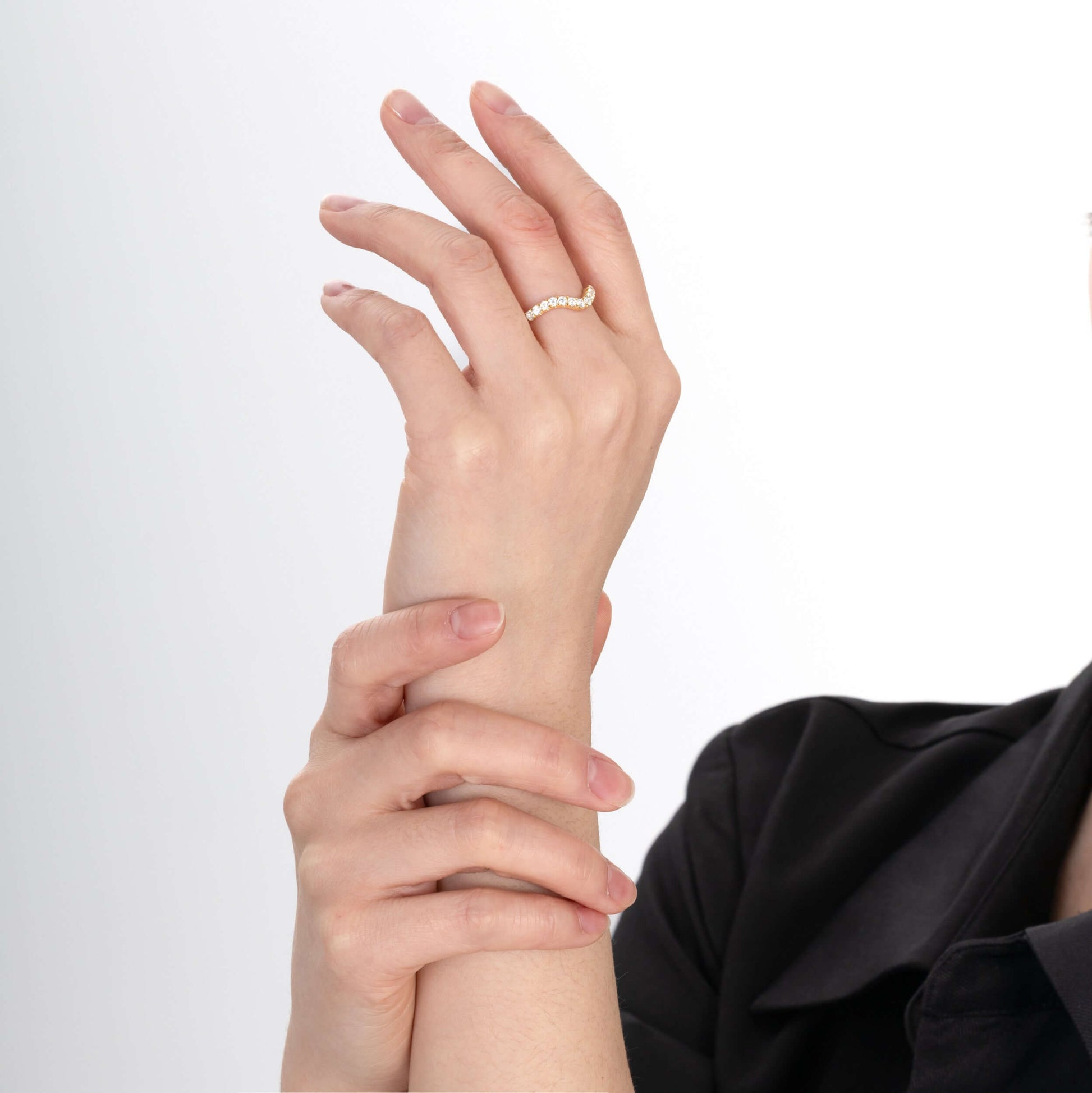 Model wearing Anya Round Cut diamond wedding band
