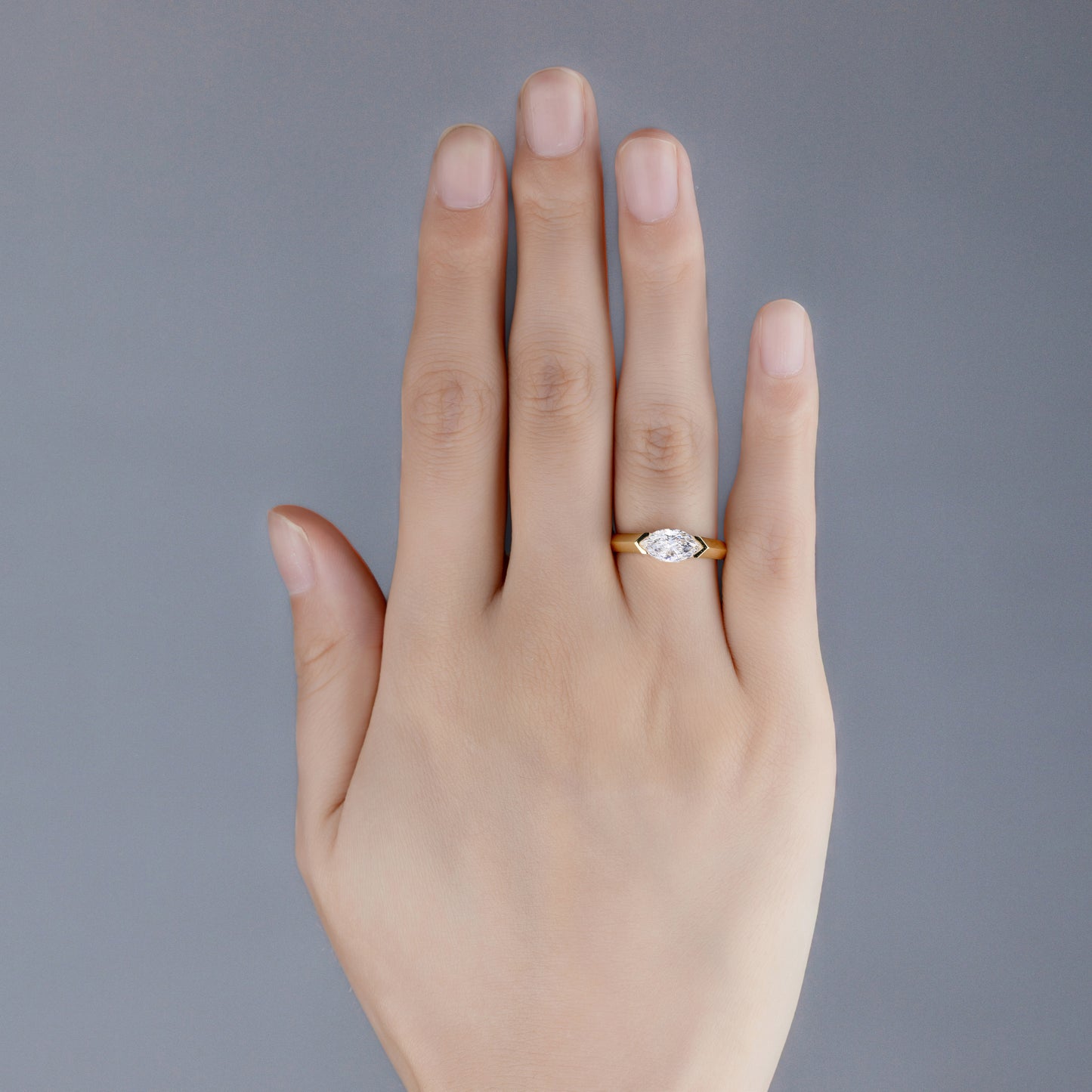 Model wearing Josie Marquise Cut Lab Diamond East West Ring with Horizontally Set design