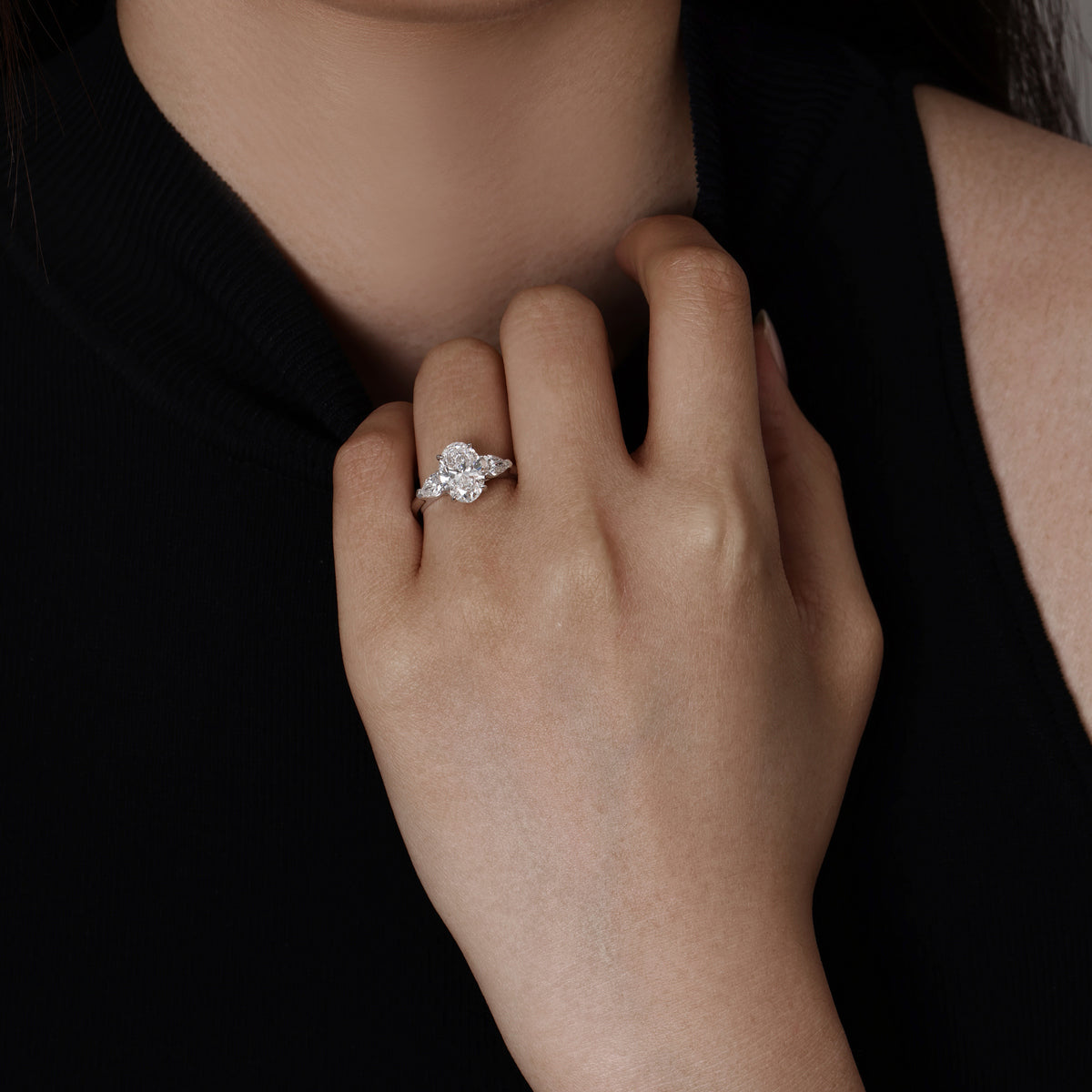 Model wearing Oval Cut Diamond Three Stone engagement ring | Dakota | Elora