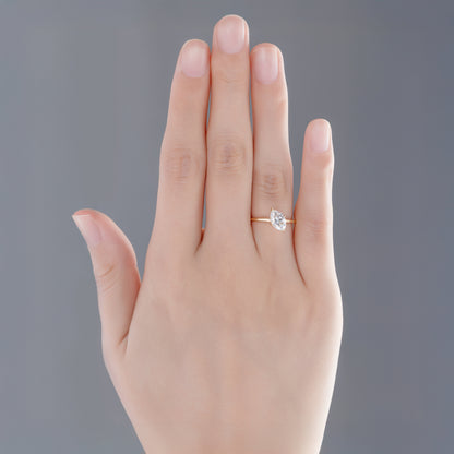 Model wearing Tilted marquise lab-grown diamond engagement ring on finger